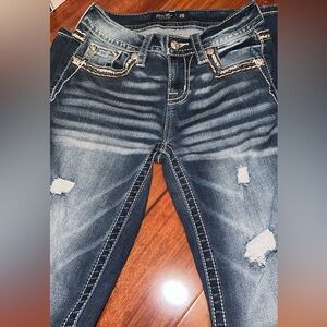 Miss Me jeans in size 25. They are mid-rise straight.